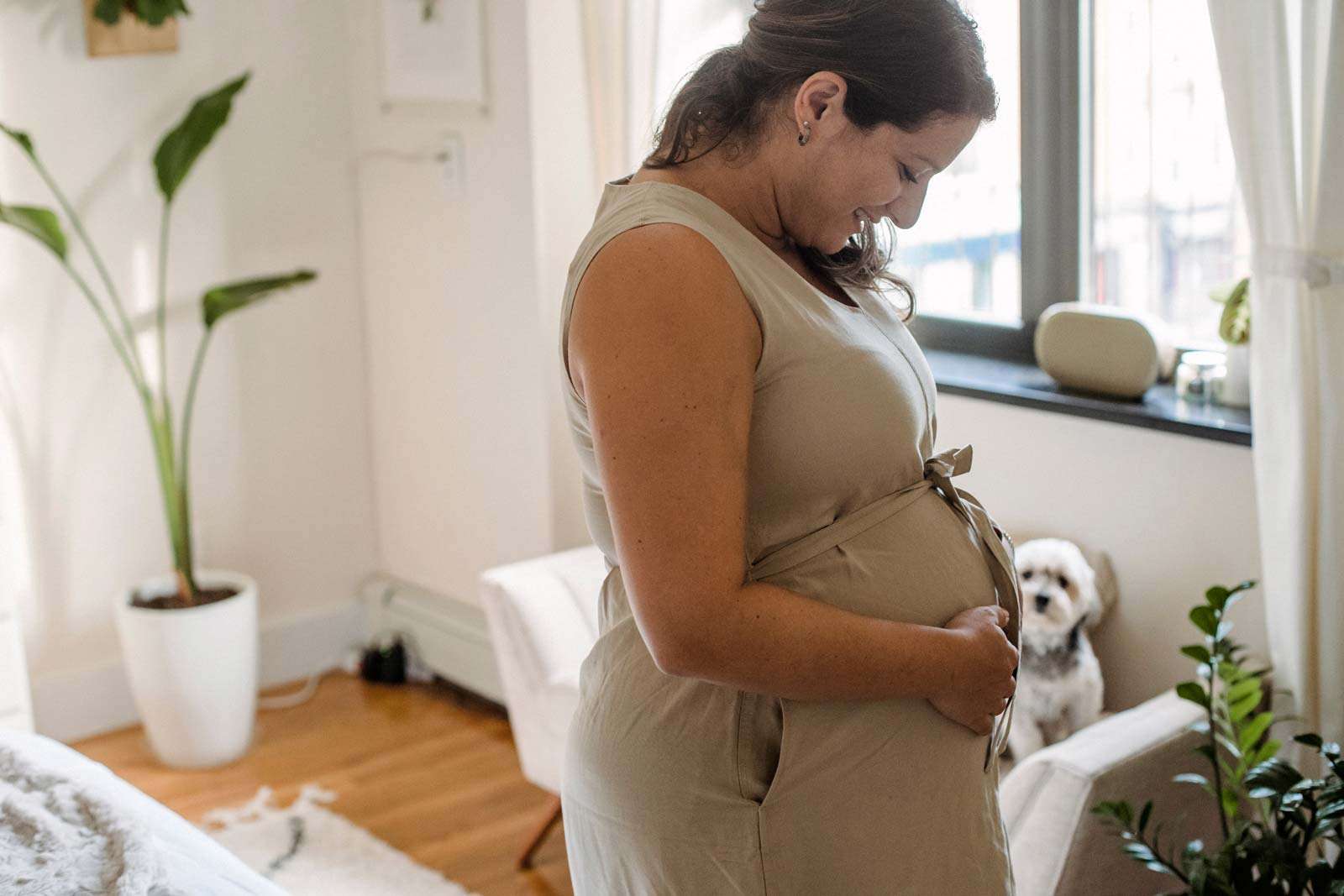 woman holding her pregnant belly