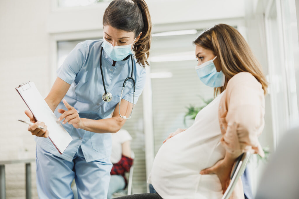 pregnant woman and nurse